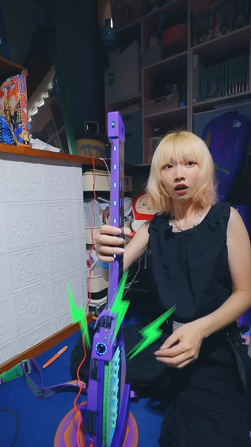 Person holding a Cyber-G EVA guitar in a room.