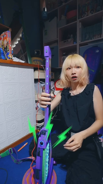 Person holding a Cyber-G EVA guitar in a room.