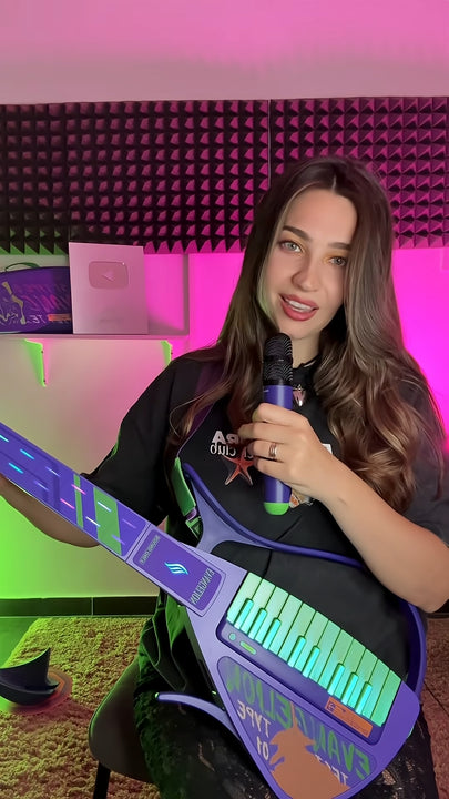 Woman holding a Cyber-G EVA guitar and microphone in a studio setting with pink and green lighting.