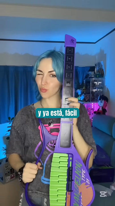 Person holding a Cyber-G EVA guitar in a room with blue lighting
