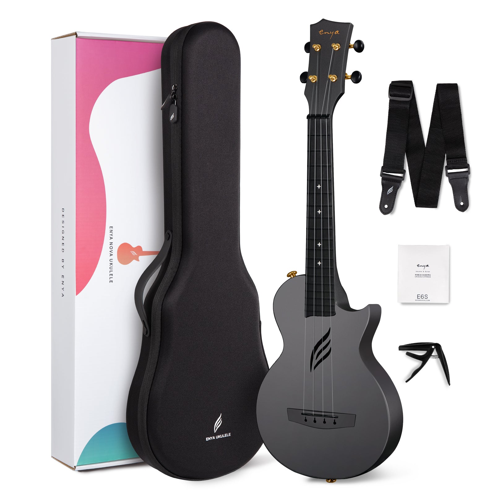 Black ukulele with accessories including a case, strap, and capo on a white background.