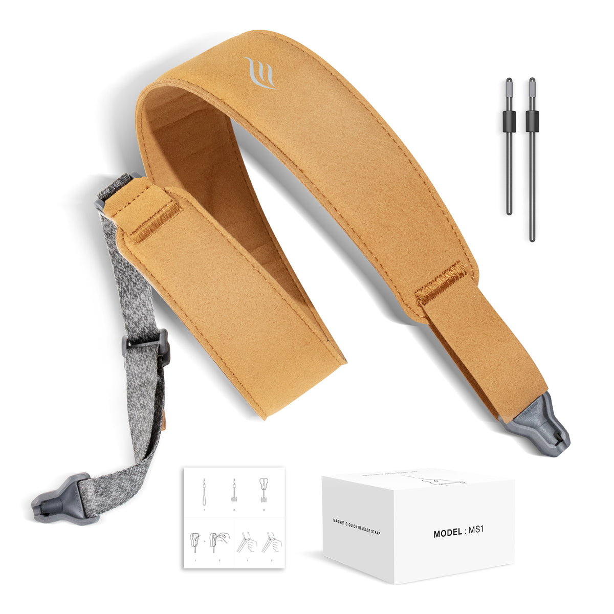 Brown guitar strap with gray accents, packaging, and accessories on a white background