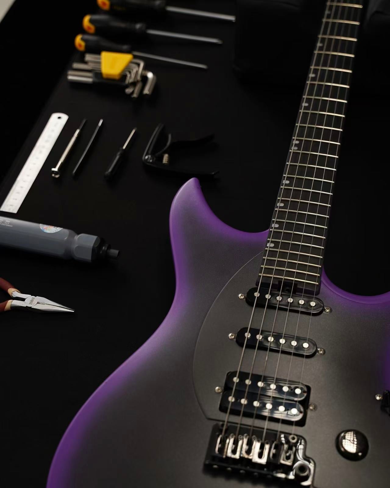 How to restring a guitar - Enya Music Workshop tutorial with string winder and tools