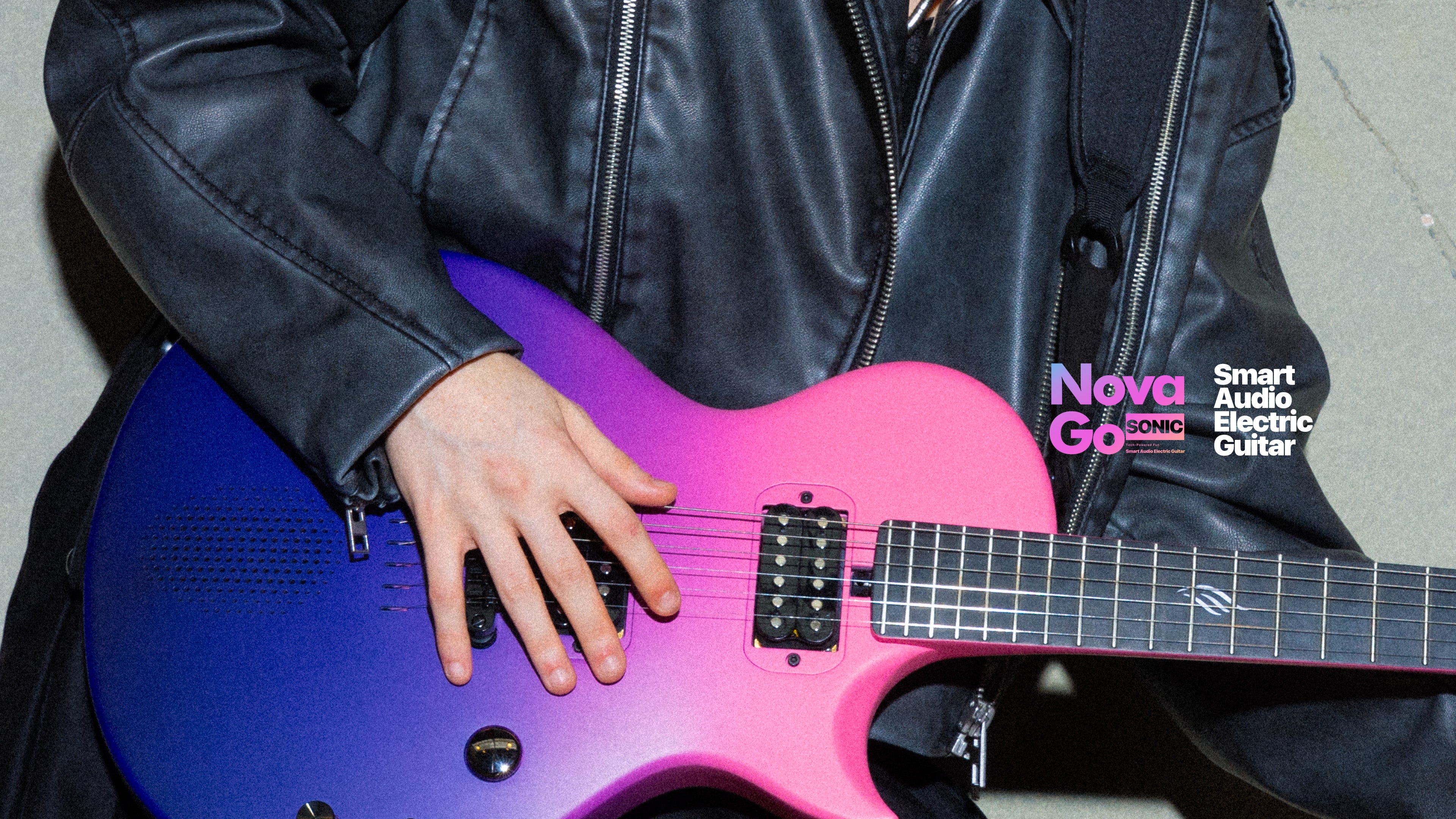 A woman playing Cosmic Purple gradient Nova Go Sonic(carbon fiber electric guitar) , wearing a black leather jacket.