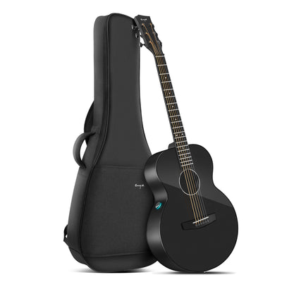 A black electric-acoustic guitar, Enya X3 Pro Mini, with a guitar gig bag.