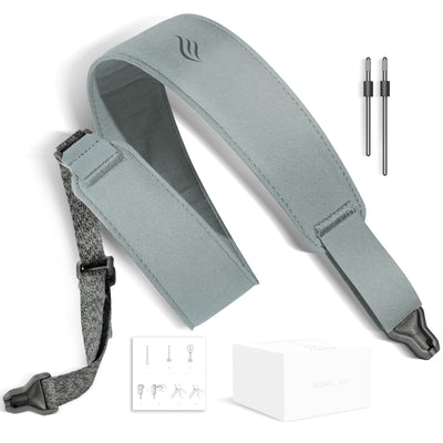 Gray blue guitar strap with accessories on a white background
